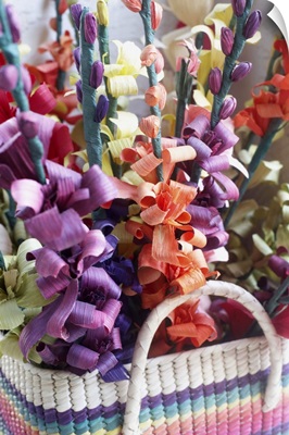 Close-up of a flower arrangement in a basket.