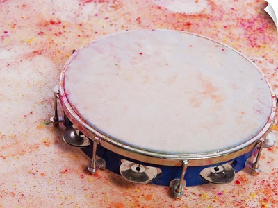 Close-up of a tambourine with Holi colors