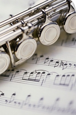 Close up of flute on sheet music