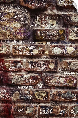 Close-up of graffiti on a brick wall in Verona, Italy