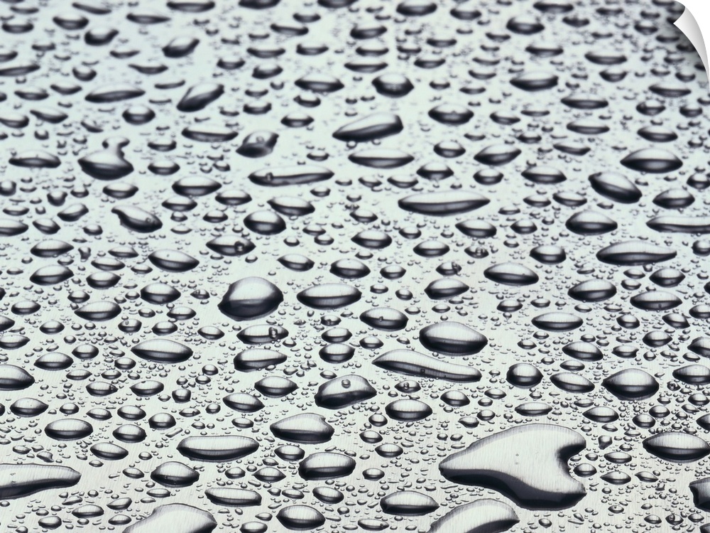 close-up of water drop on a gray surface
