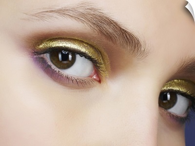 Closeup of eyes with gold eyeshadow