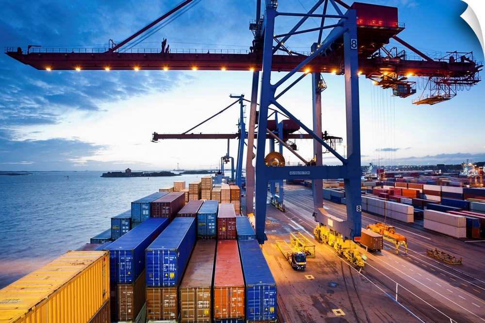 Container terminal at dusk, view from cargo ship