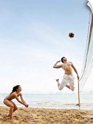 Couple Playing Beach Volleyball at Six Senses Hideaway Yao Noi, Koh Yao Noi, Thailand.