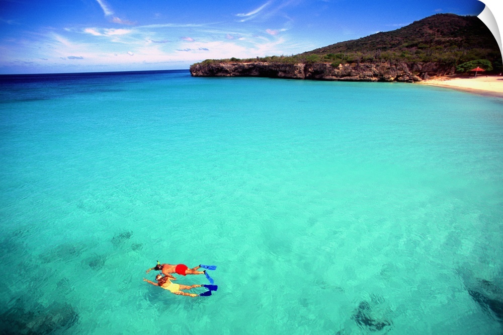 Couple snorkeling in crystal clear water off Knip Beach in Curacao