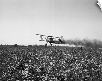Crop Dusting Plane Flies Over Field