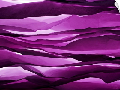 Crumpled sheets of purple paper.