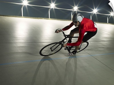 Cyclist in action on velodrome track