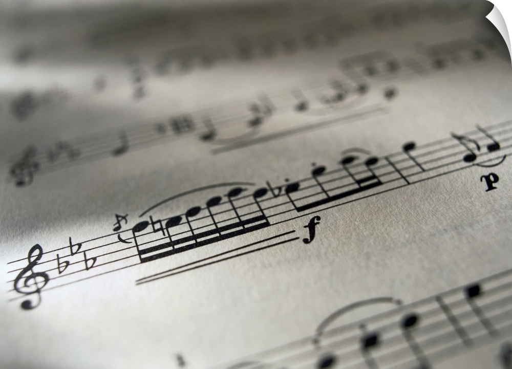 Large canvas photo of the up close view of a music sheet with musical notes.
