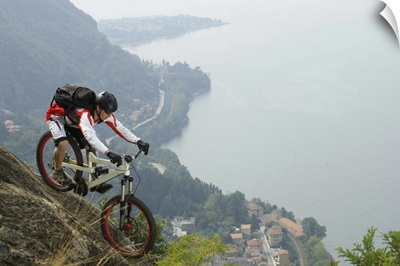 Downhill cyclist on an abyss