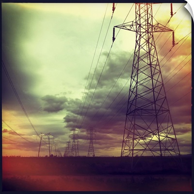 Electricity pylons against cloudy sky in Woodland, California, US.