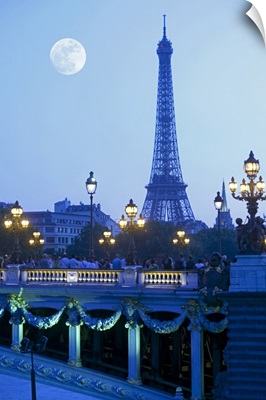 Evening view of Eiffel Tower at moonrise