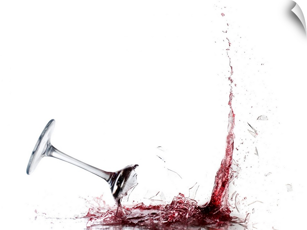 Giant photograph displays a piece of stemware filled with vino as it crashes into the ground and the liquid splashes out.