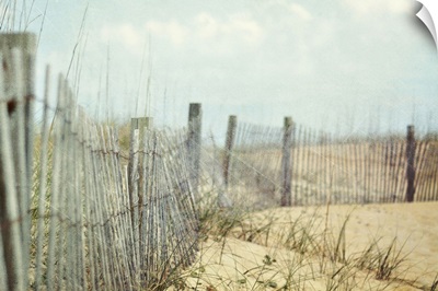 Fence on sand dunes at beach.