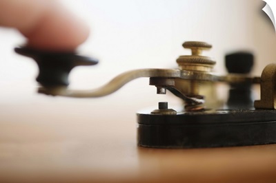 Finger pressing telegraph key, studio shot