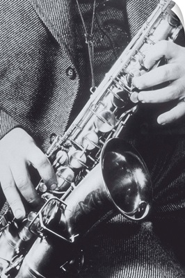 Fingers positioned on saxophone, 1940's