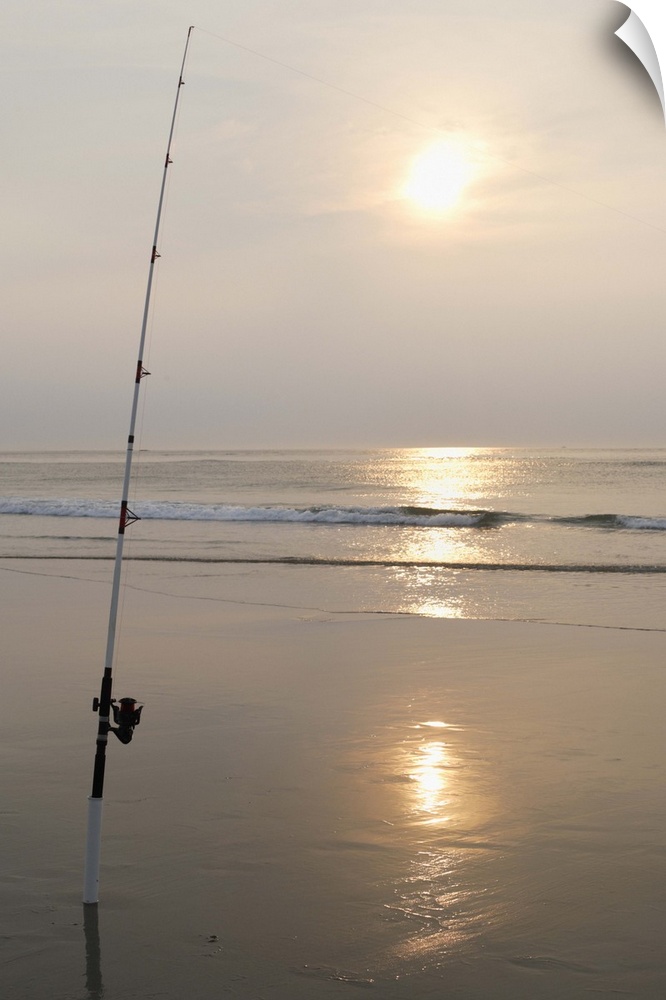 Fishing rod by the ocean in the early morning.