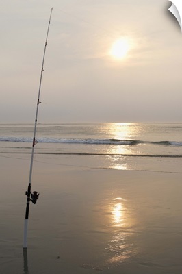 Fishing rod by the ocean in the early morning