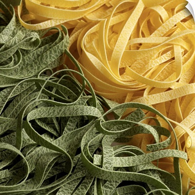 Fresh dry fettuccini pasta in green and yellow