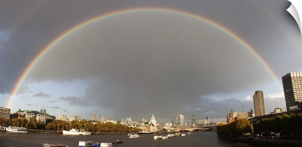 Full arc rainbow, with partial double rainbow in frame, taken from Waterloo Bridge London looking eastwards up River Thame...