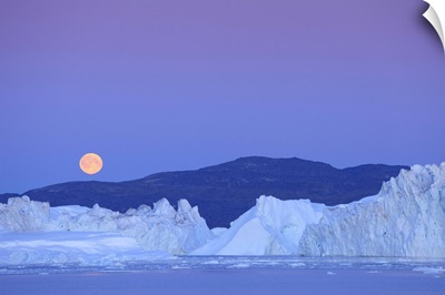 Full moon over iceberg, Ilulissat, Icefjord, Greenland,