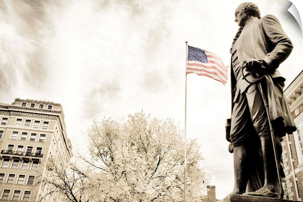 A statue of George Washington with the American flag in the background...shot in front of Independence Hall.
