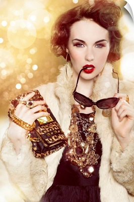 Glamorous woman with gold chains and fur coat