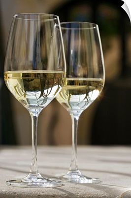 Glasses of white wine on table