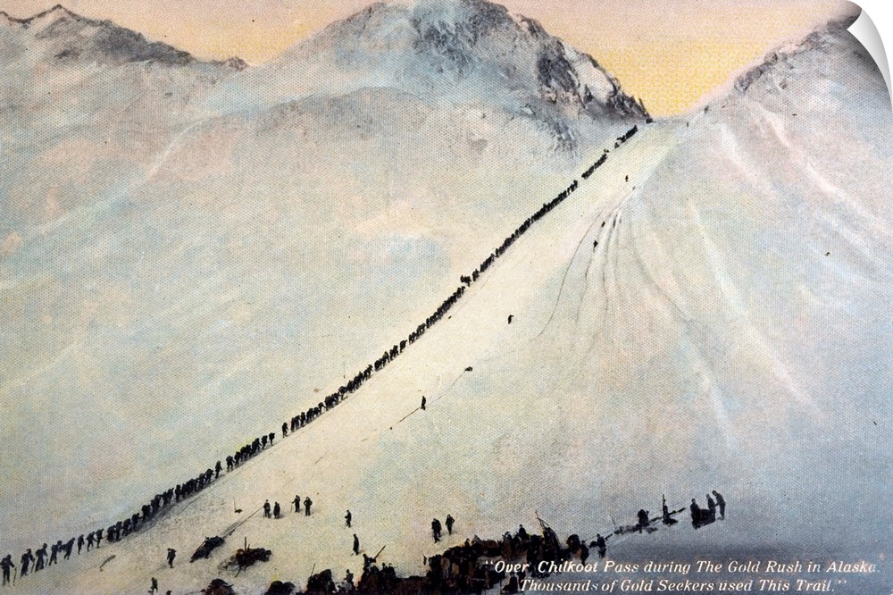 Long line of gold prospectors climb the stairs cut into the ice on the Chilkoot Trail through Chilkoot Pass during the Klo...