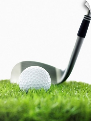 Golf Club And Golf Ball On Grass