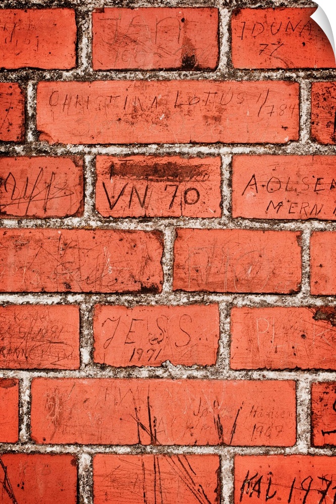 Graffiti on red brick wall