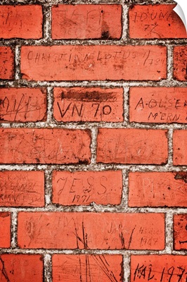 Graffiti on red brick wall