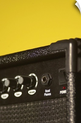 Guitar amplifier on yellow background