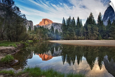 Half Dome reflecting in  Merced river in Yosemite National Park.