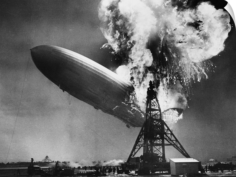 The airship Hindenburg explodes into a huge ball of fire as it comes in for a landing at Lakehurst, New Jersey. Miraculous...