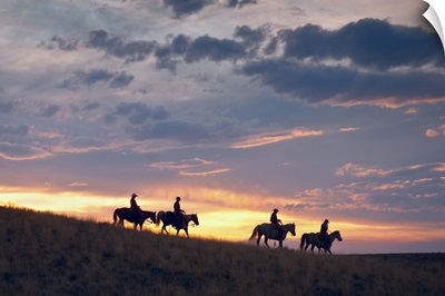 Horseback Riders At Sunset