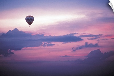 Hot air balloon in sky at dawn
