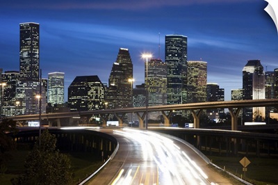 Houston skyline at dusk with freeway in foreground, Texas