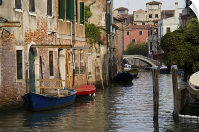 Italy, Venice, Scenic view on canal with rowboats