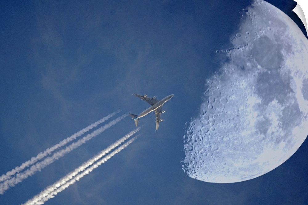 Jet in evening sky and moon, Germany.