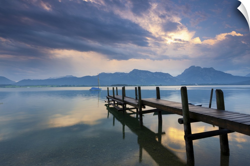 jetty at lake forggensee after a thunderstorm in the allgu, Bavaria, Germany