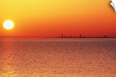 Lake Michigan under an orange sunset, Chicago side