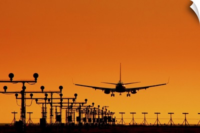 Landing of an airplane at sunset