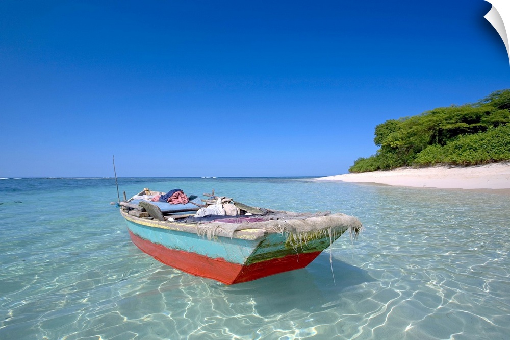 Haiti, Nord, local boat at Isla Amiga. Isla Amiga was named and marked by Christopher Columbus on his first voyage to the ...
