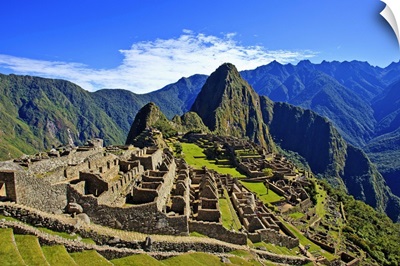 Machu Picchu is a 15th century Inca site on a mountain ridge above the Urubamba Valley