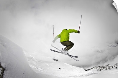 Man ski touring on snow rock in Chamonix, France.