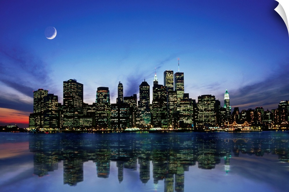 Manhattan skyline at night, reflecting in river