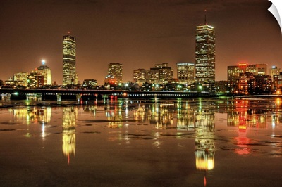 Massachusetts Avenue Bridge and Boston skyline, reflected in the Charles River at night