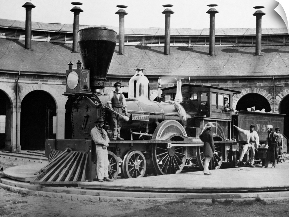 Men turn the Great Western Railway steam locomotive No. 4. in 1859. The locomotive is mainly British in design.