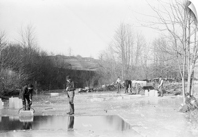Men Cutting Ice From Frozen Pond